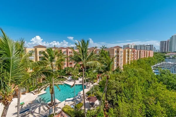 a view of a a dining room with furniture window and wooden floor