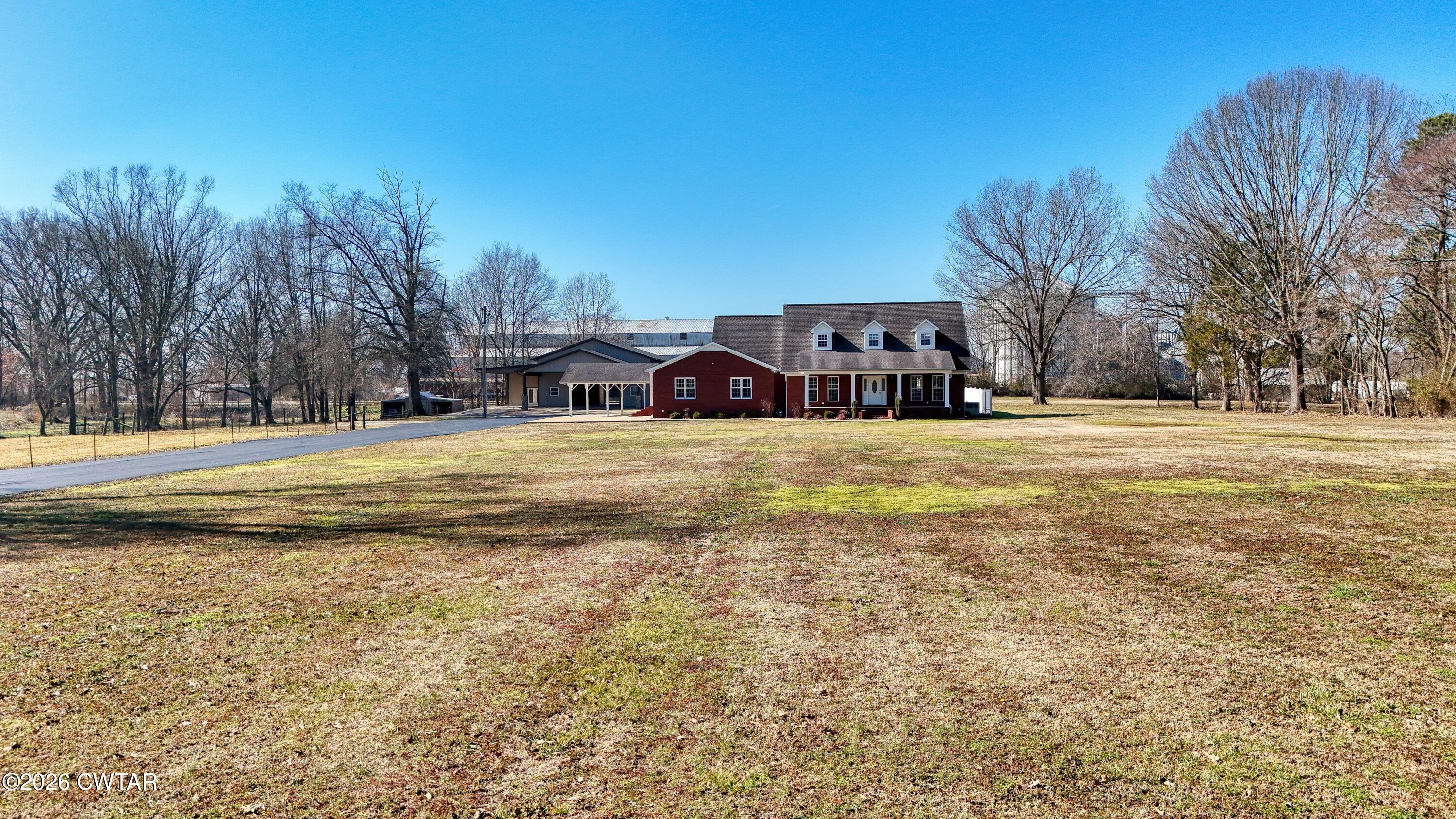 101 Oak Lane Gleason, TN 38229 - Photo 12 of 50 a view of a swimming pool with an outdoor space and seating area