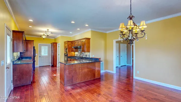 a view of a living room and kitchen