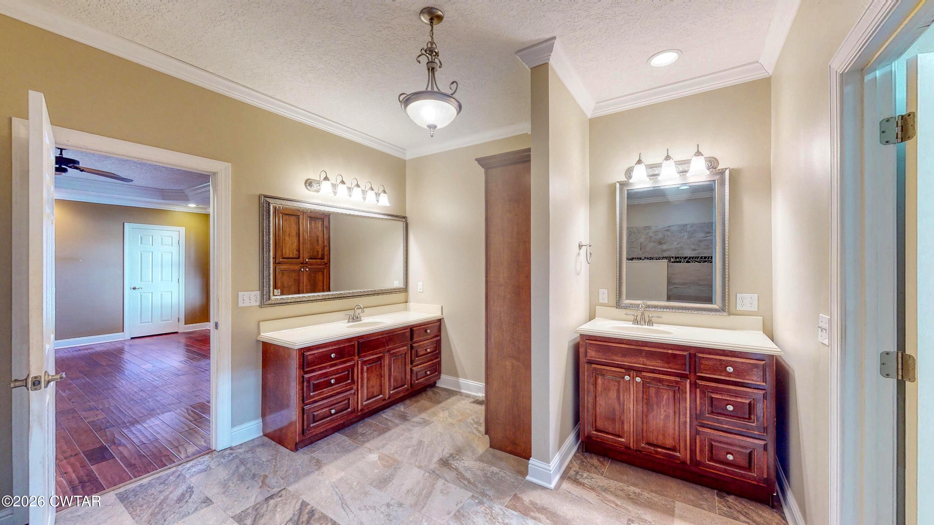 101 Oak Lane Gleason, TN 38229 - Photo 23 of 50 a bathroom with a sink a vanity and a large mirror