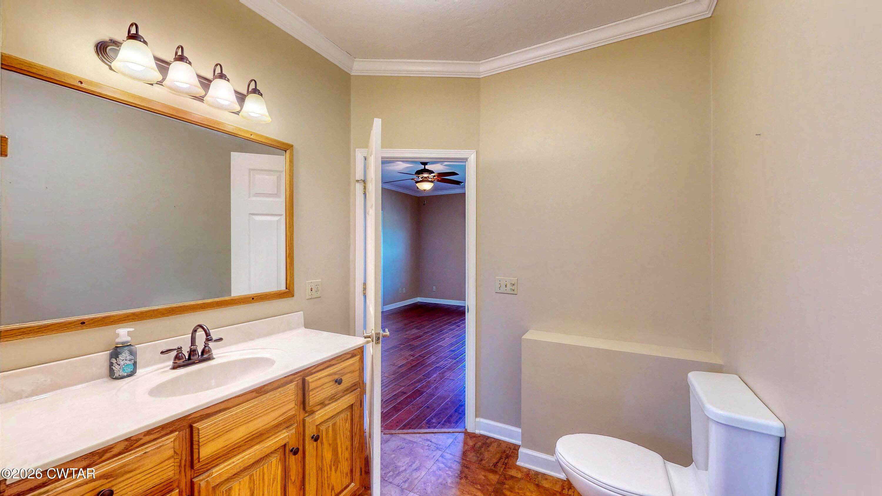 101 Oak Lane Gleason, TN 38229 - Photo 24 of 50 a bathroom with a sink vanity mirror and toilet