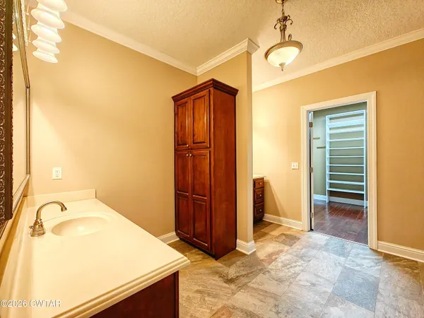 a view of a bathroom with a tub and shower