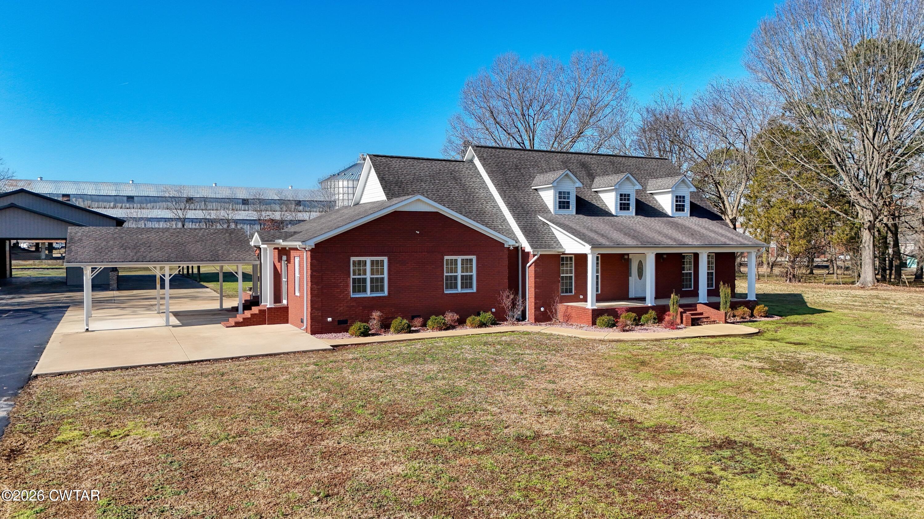 101 Oak Lane Gleason, TN 38229 - Photo 3 of 50 a view of a house with a yard patio and fire pit