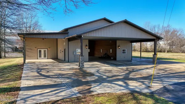 a view of a house with wooden floor and fence