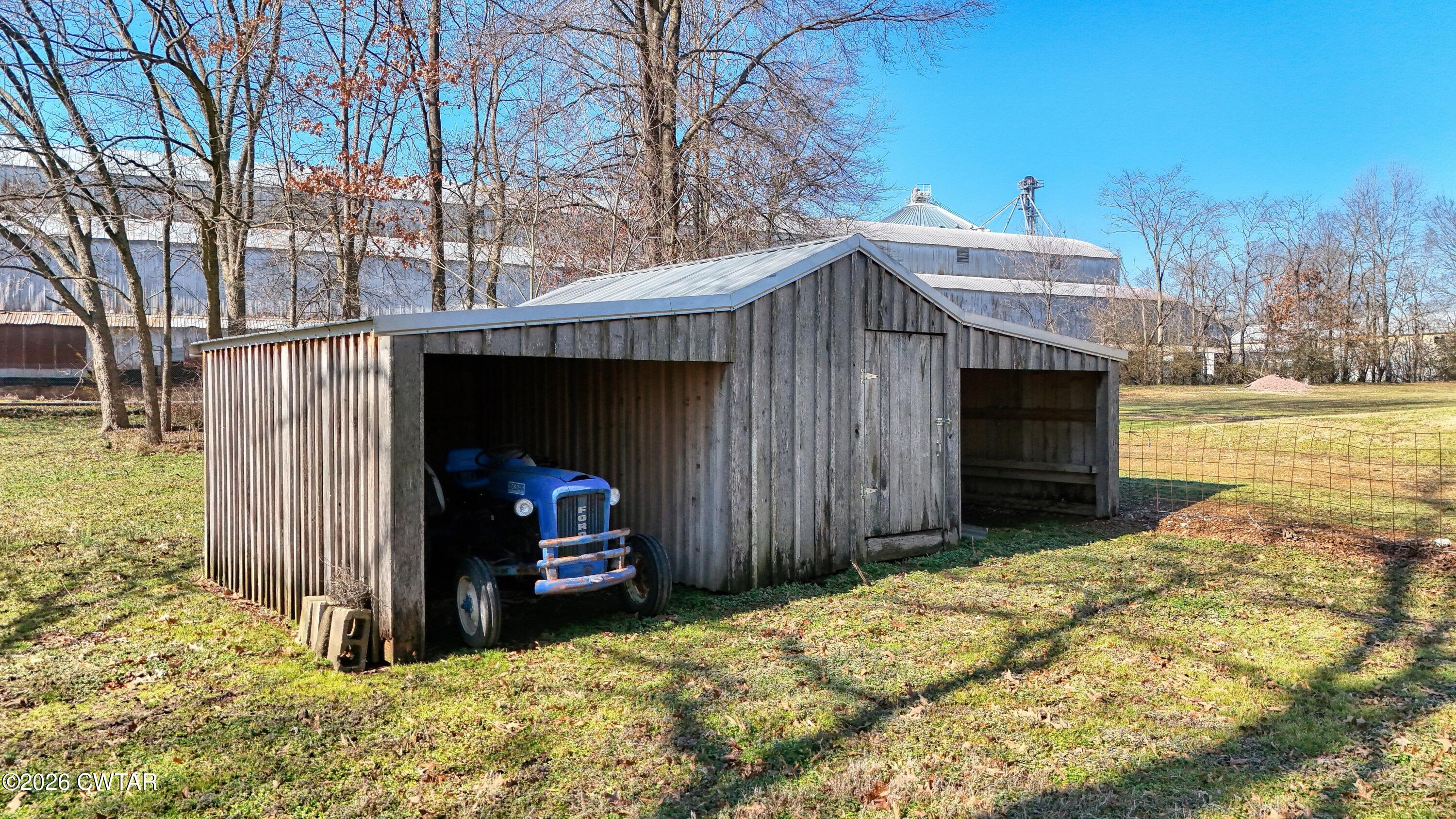 101 Oak Lane Gleason, TN 38229 - Photo 47 of 50 a view of a house with a yard and garage