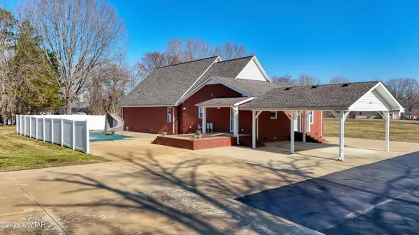 a view of a house with wooden floor and a yard