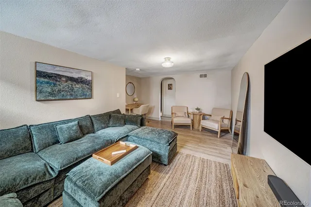 a bedroom with a bed and a desk