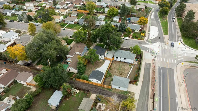 an aerial view of residential houses with outdoor space