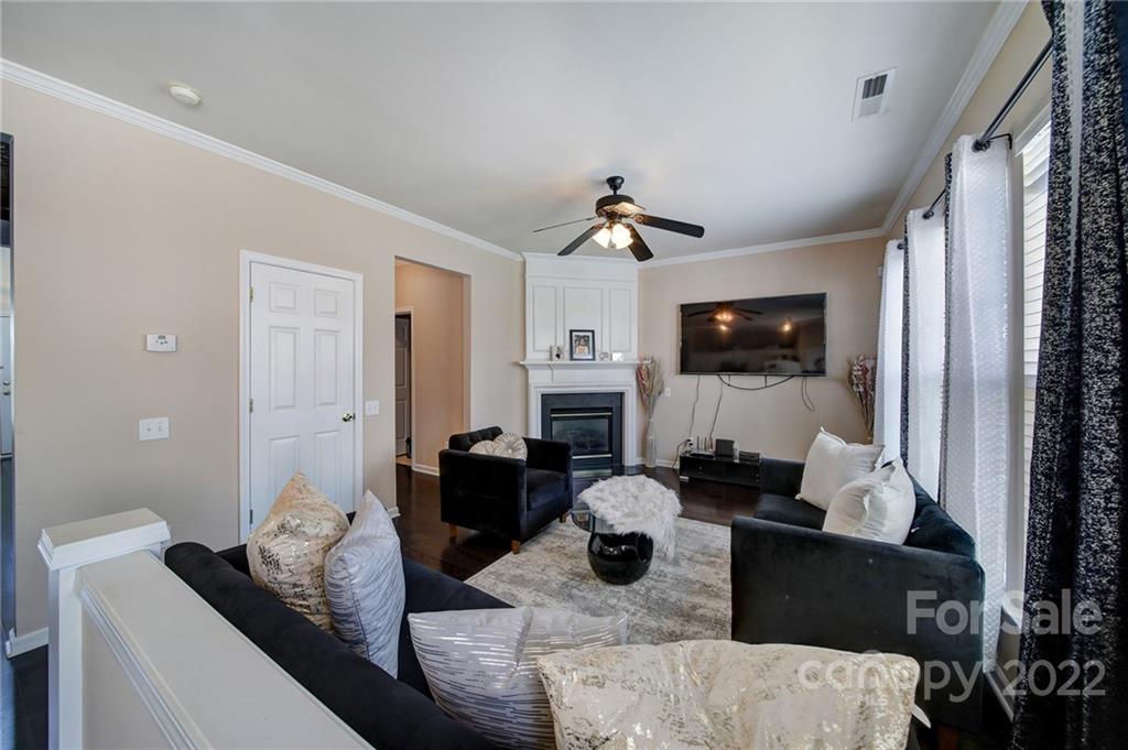 11428 Grove Point Road Charlotte, NC 28277 - Photo 12 of 36 a living room with furniture and a flat screen tv