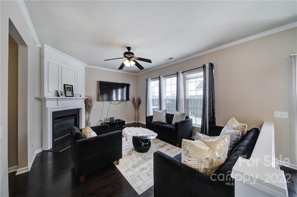 11428 Grove Point Road Charlotte, NC 28277 - Photo 13 of 36 a living room with furniture fireplace and flat screen tv
