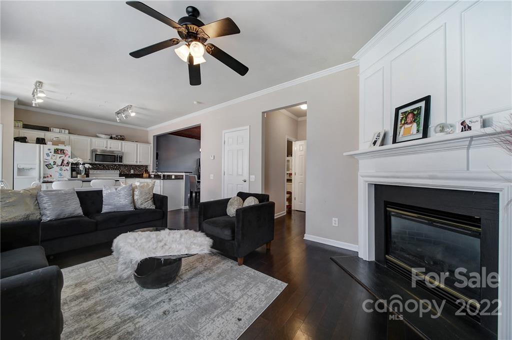 11428 Grove Point Road Charlotte, NC 28277 - Photo 14 of 36 a living room with furniture and a fireplace