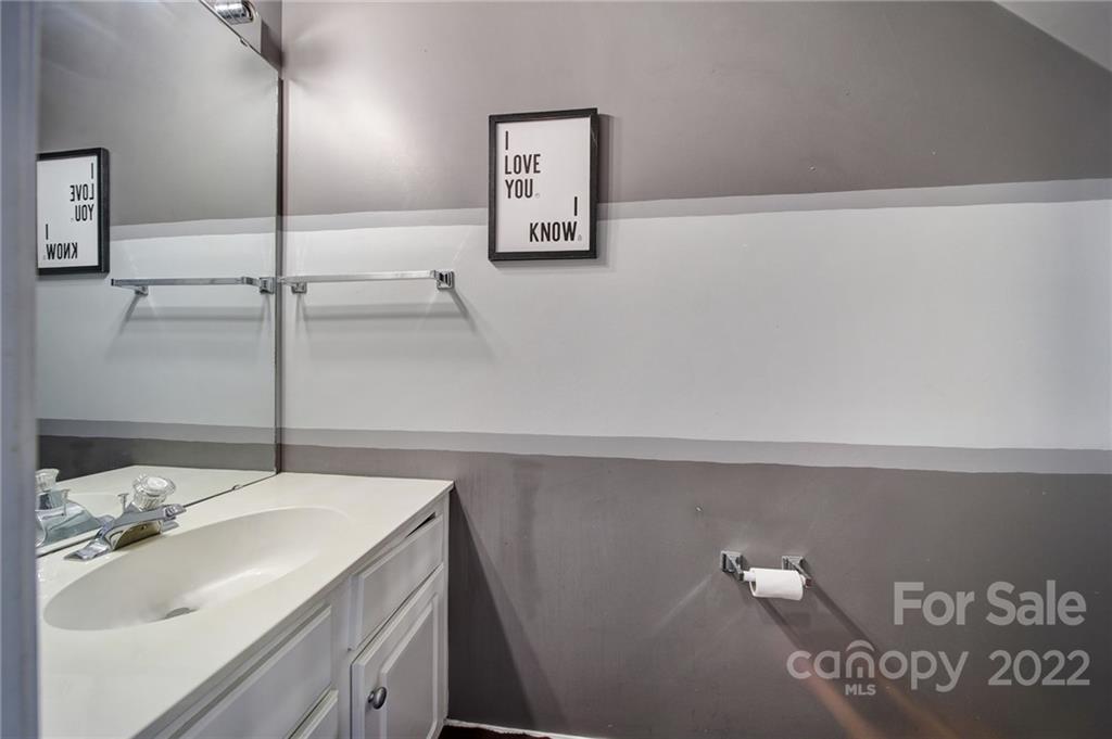 11428 Grove Point Road Charlotte, NC 28277 - Photo 15 of 36 a bathroom with a sink and a mirror