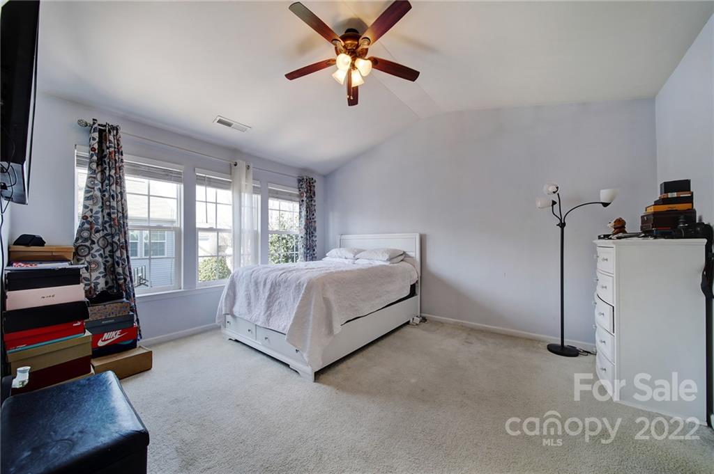 11428 Grove Point Road Charlotte, NC 28277 - Photo 17 of 36 a bedroom with a bed and a window