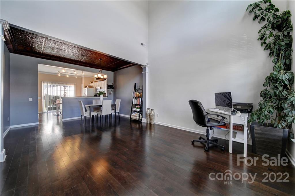 11428 Grove Point Road Charlotte, NC 28277 - Photo 2 of 36 a workspace with furniture window and wooden floor