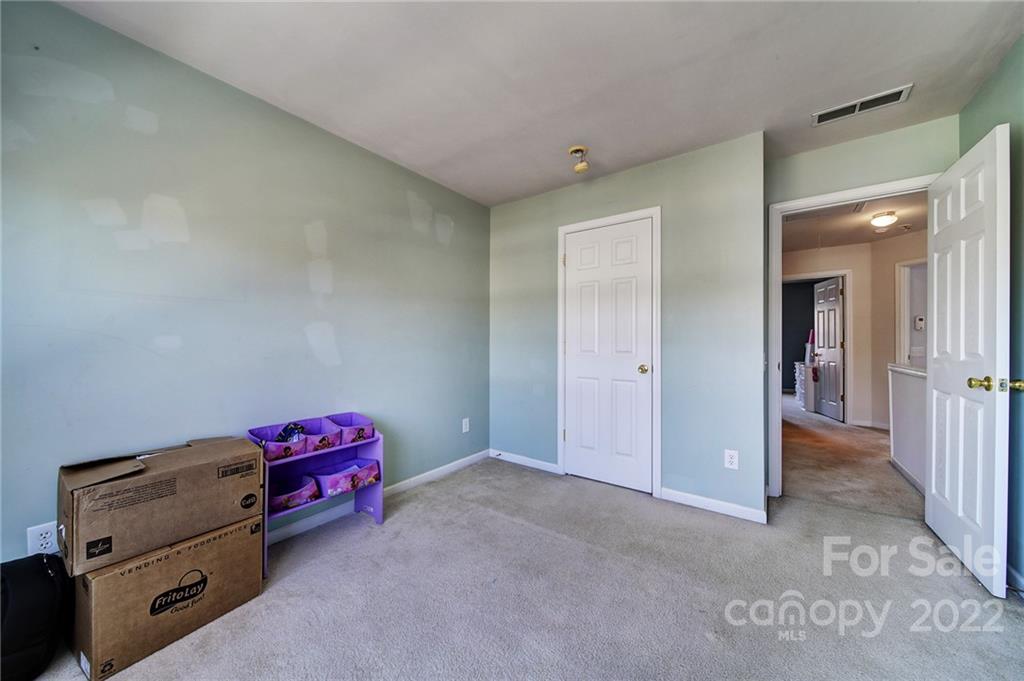 11428 Grove Point Road Charlotte, NC 28277 - Photo 23 of 36 a view of room with baby crib