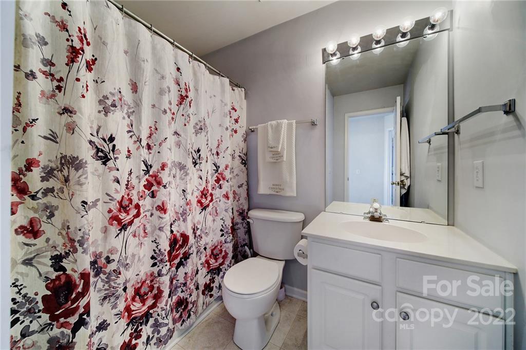 11428 Grove Point Road Charlotte, NC 28277 - Photo 24 of 36 a bathroom with a sink toilet and shower