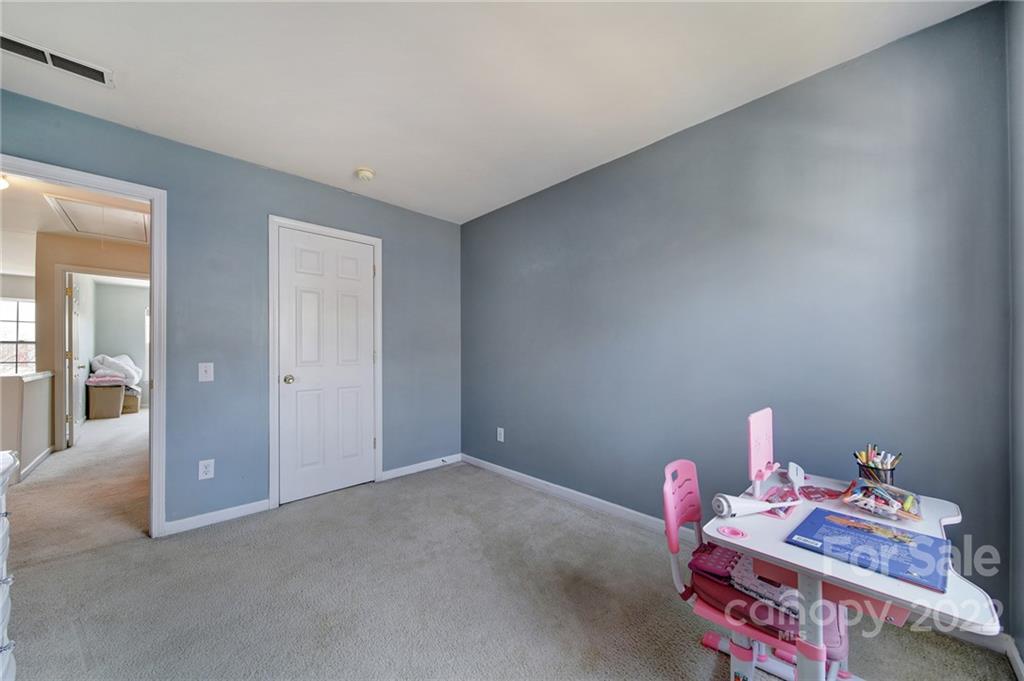 11428 Grove Point Road Charlotte, NC 28277 - Photo 26 of 36 a room with toys and a wooden floor