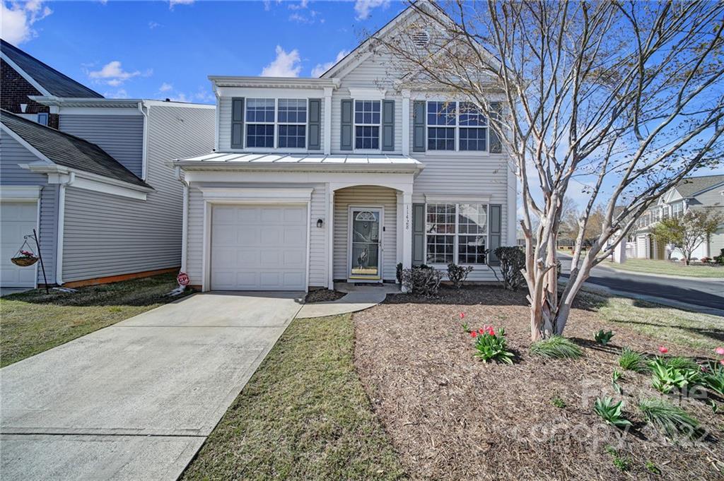 11428 Grove Point Road Charlotte, NC 28277 - Photo 29 of 36 a front view of a house with garden