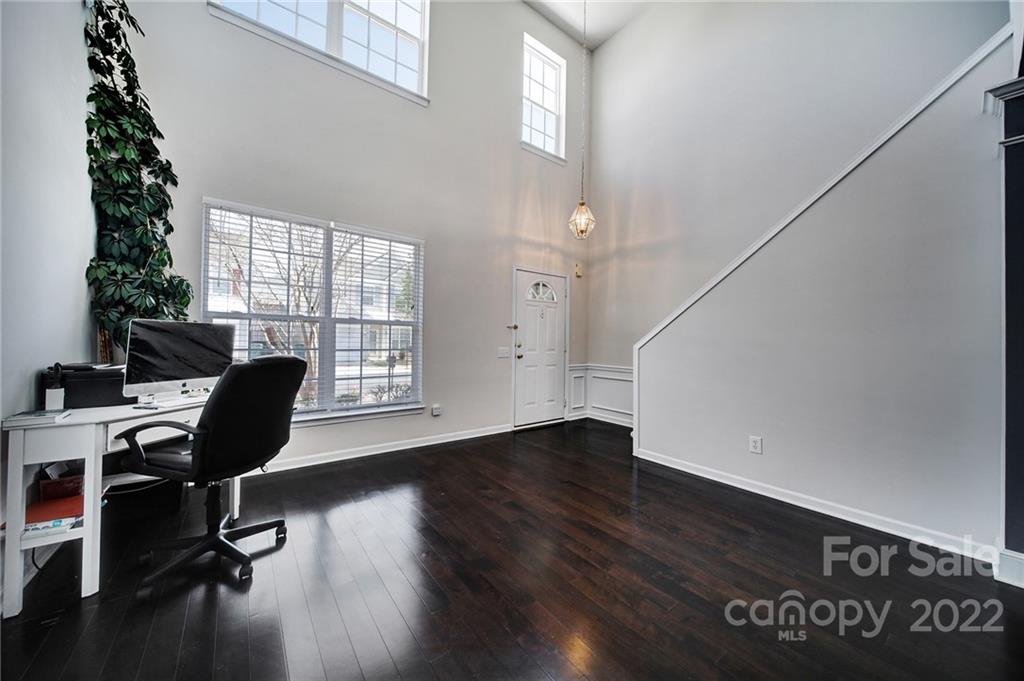 11428 Grove Point Road Charlotte, NC 28277 - Photo 3 of 36 a view of a workspace with furniture and a window