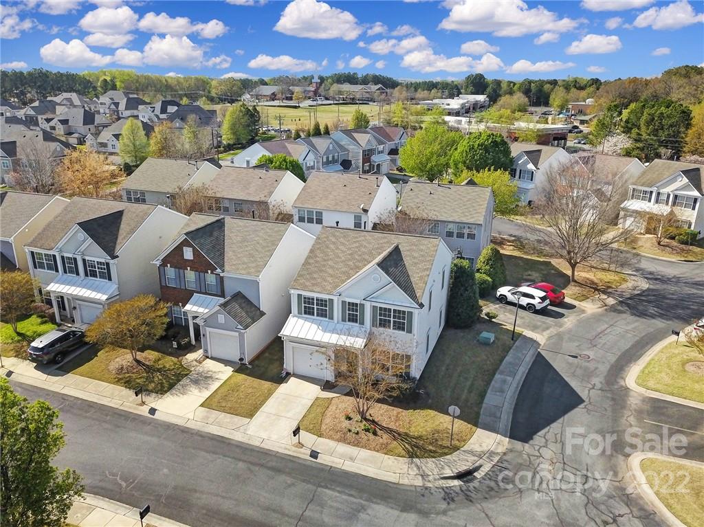 11428 Grove Point Road Charlotte, NC 28277 - Photo 32 of 36 an aerial view of a house with a garden and lake view