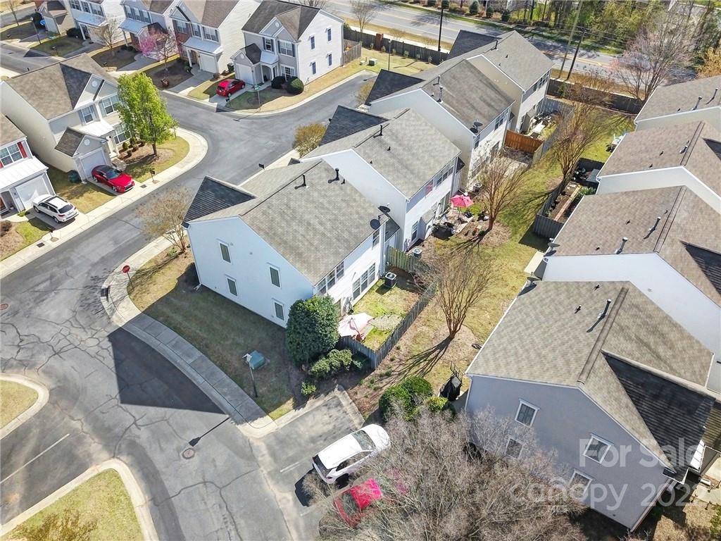 11428 Grove Point Road Charlotte, NC 28277 - Photo 35 of 36 an aerial view of a house with a swimming pool and outdoor seating