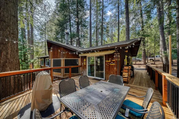 a view of balcony with furniture and wooden deck