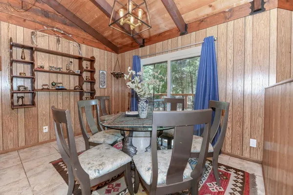 a balcony with table and chairs