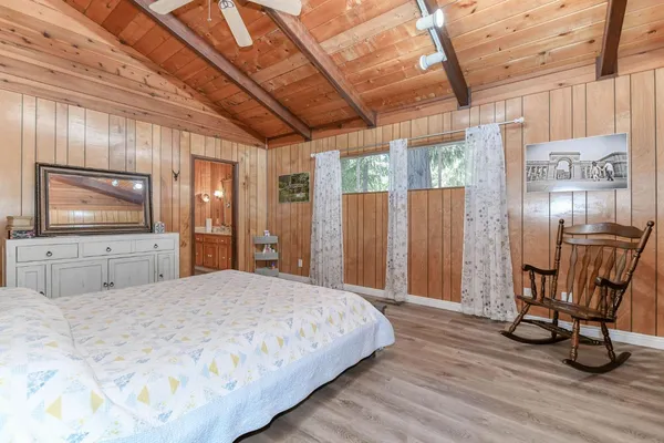 a bathroom with a toilet and a shower curtain