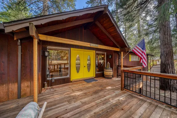 a view of a house with wooden floor and wooden fence