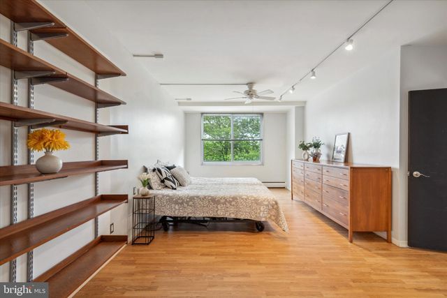a bedroom with furniture and window