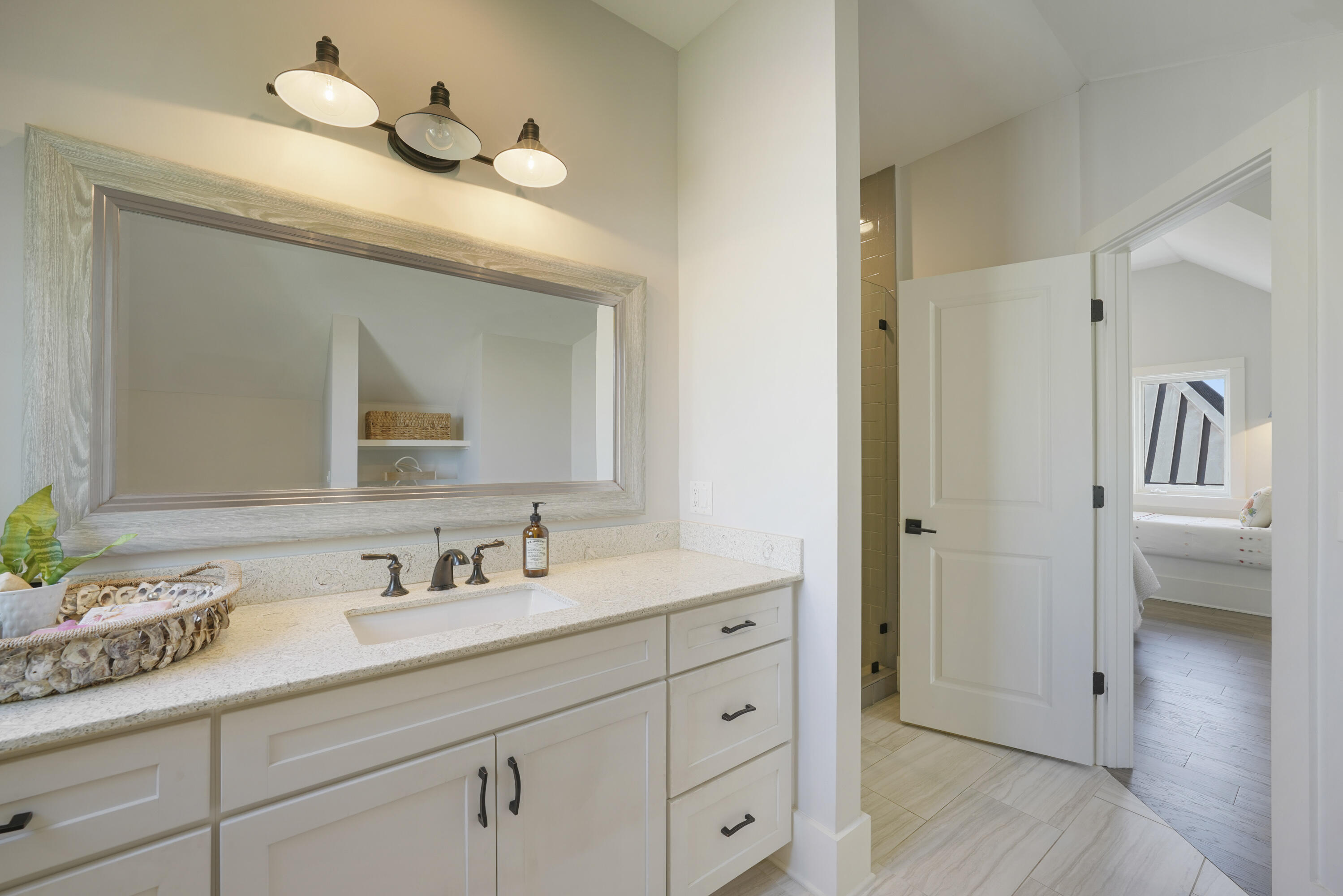 18 Bourne Lane Inlet Beach, FL 32461 - Photo 48 of 81 a bathroom with a sink a vanity and a mirror