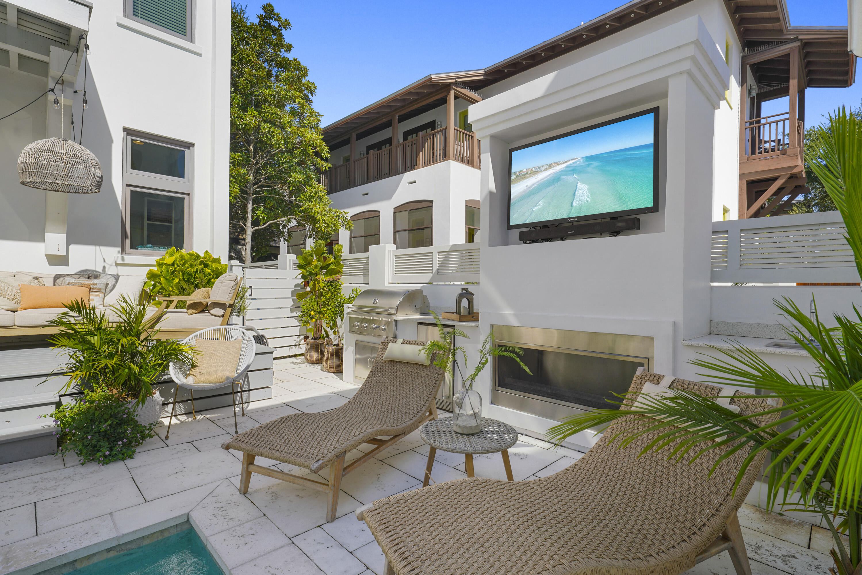 18 Bourne Lane Inlet Beach, FL 32461 - Photo 9 of 81 a view of a patio with couches table and chairs and potted plants