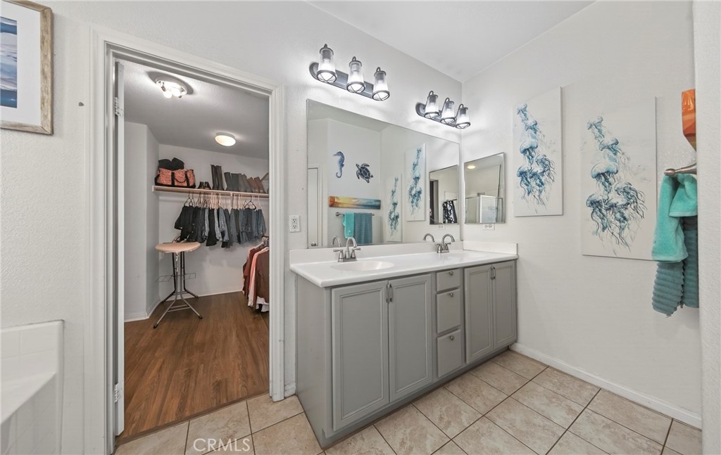1433 Fall Brook Road Beaumont, CA 92223 - Photo 19 of 33 a bathroom with a sink vanity and mirror