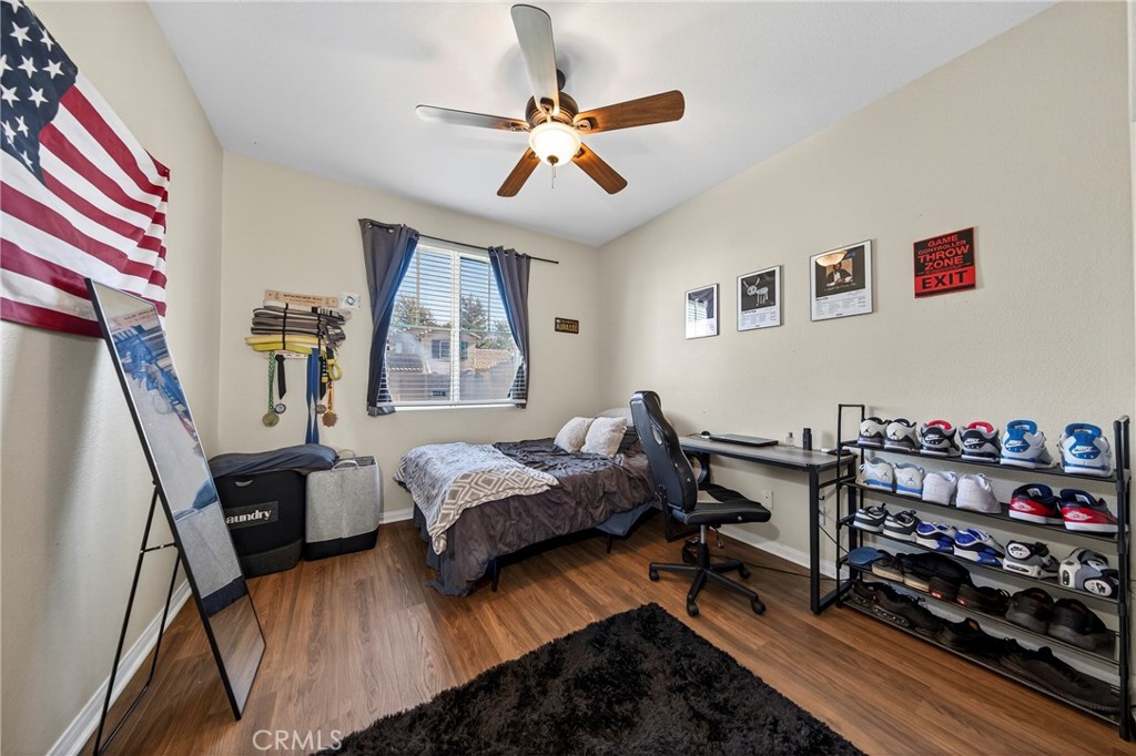 1433 Fall Brook Road Beaumont, CA 92223 - Photo 21 of 33 a bed room with a bed and a window