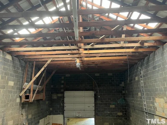 a view of a patio with table and chairs