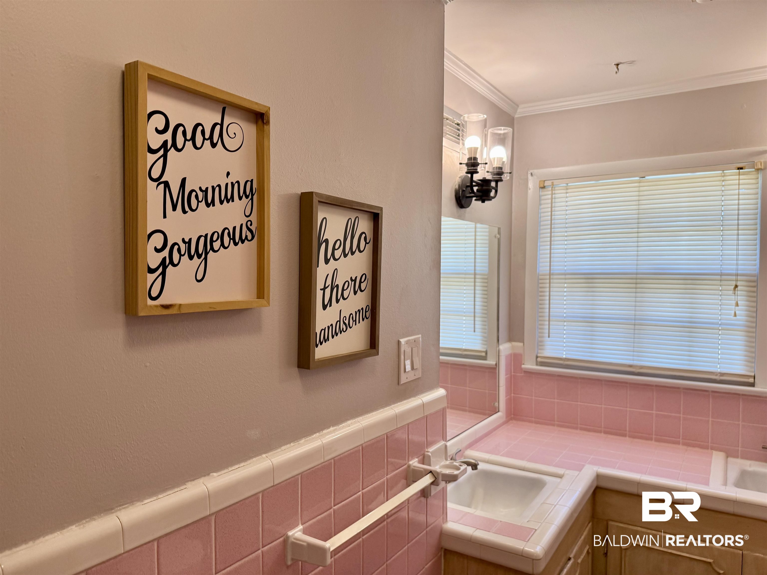 2785 Appleton Road Brewton, AL 36426 - Photo 19 of 28 Bathroom featuring vanity, tile walls, ornamental molding, and wainscoting