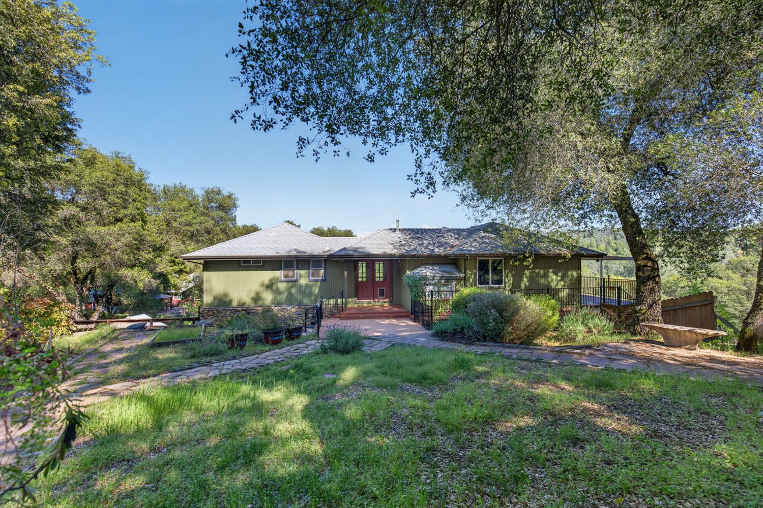 4450 Cosumnes View Trail Placerville, CA 95667 - Photo 1 of 69 a front view of a house with garden