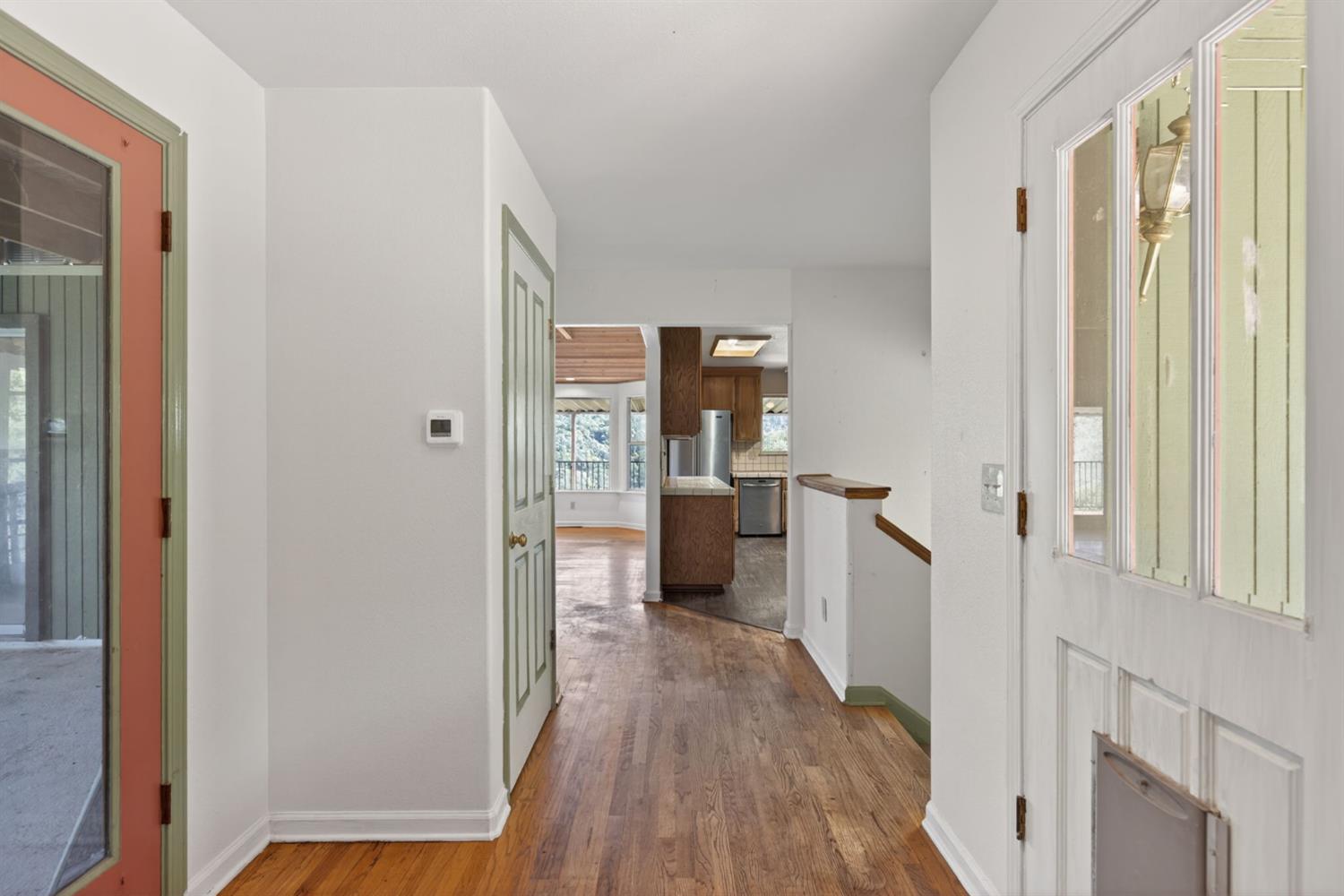 4450 Cosumnes View Trail Placerville, CA 95667 - Photo 16 of 69 a view of a kitchen from the hallway with a wooden floor