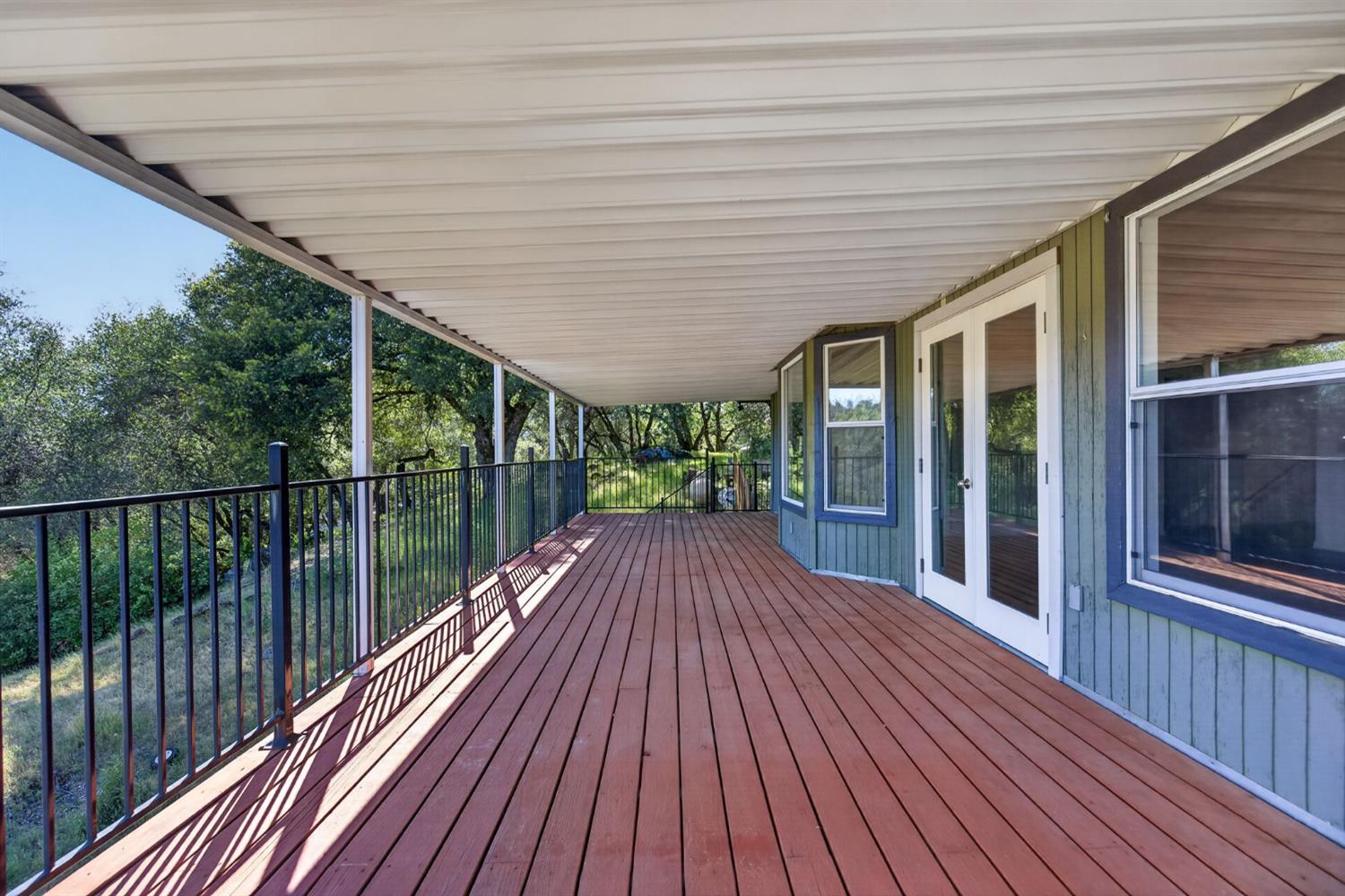 4450 Cosumnes View Trail Placerville, CA 95667 - Photo 25 of 69 a view of balcony with wooden floor and floor to ceiling window