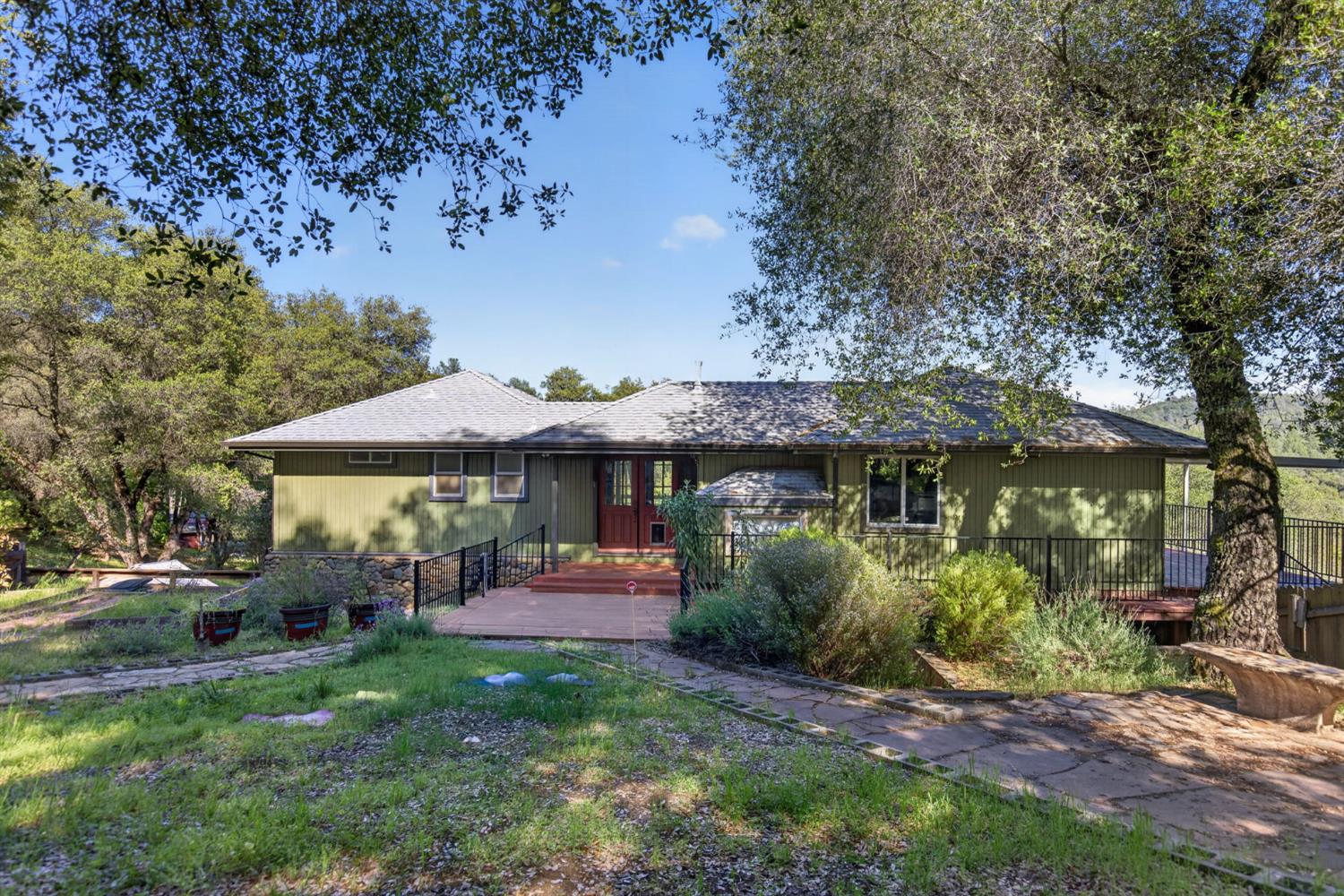 4450 Cosumnes View Trail Placerville, CA 95667 - Photo 46 of 69 a view of a patio with table and chairs under an umbrella