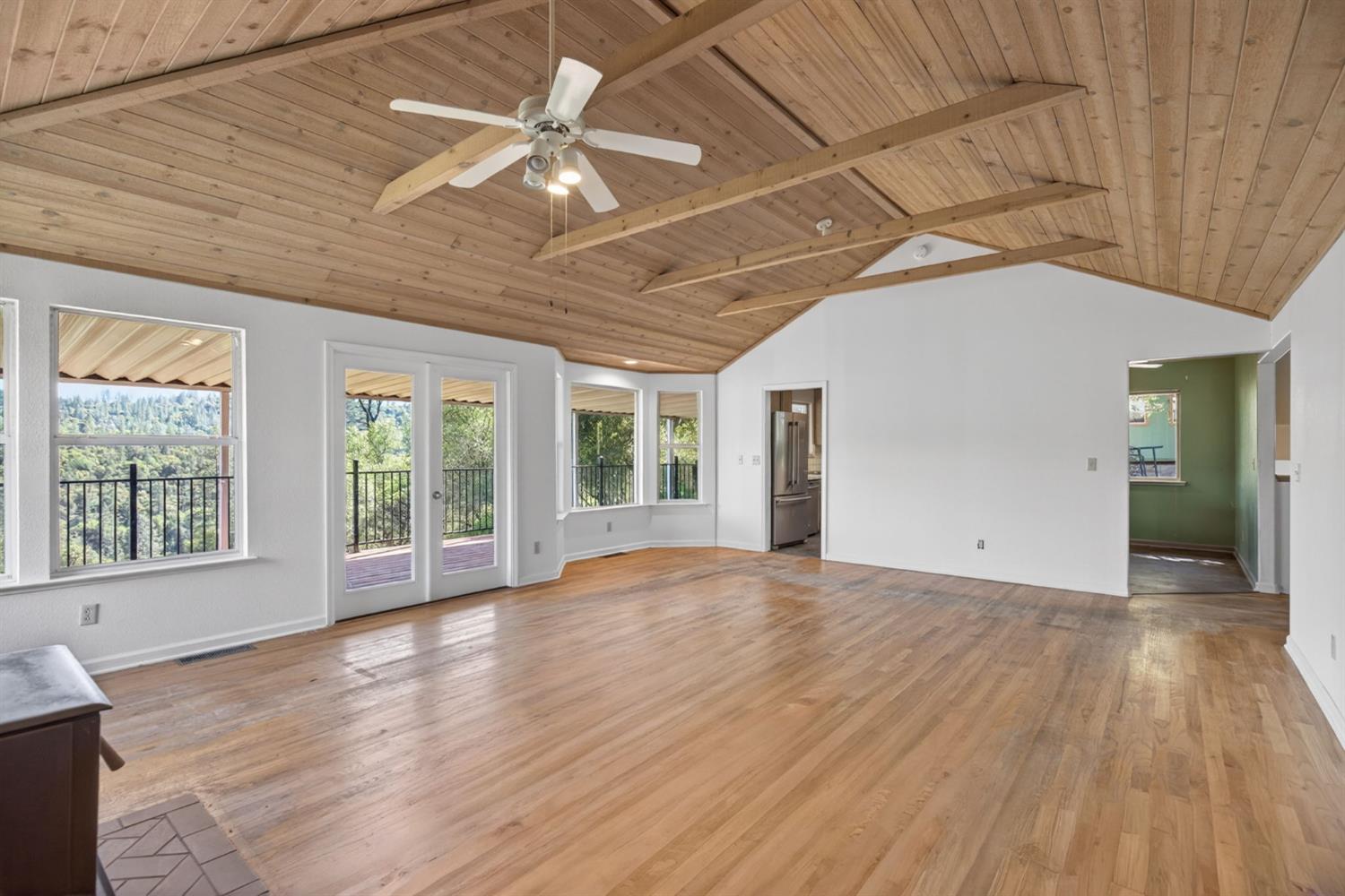 4450 Cosumnes View Trail Placerville, CA 95667 - Photo 6 of 69 a view of an empty room with wooden floor and a window