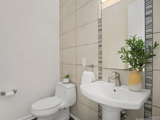 a view of a room with wooden floor and furniture