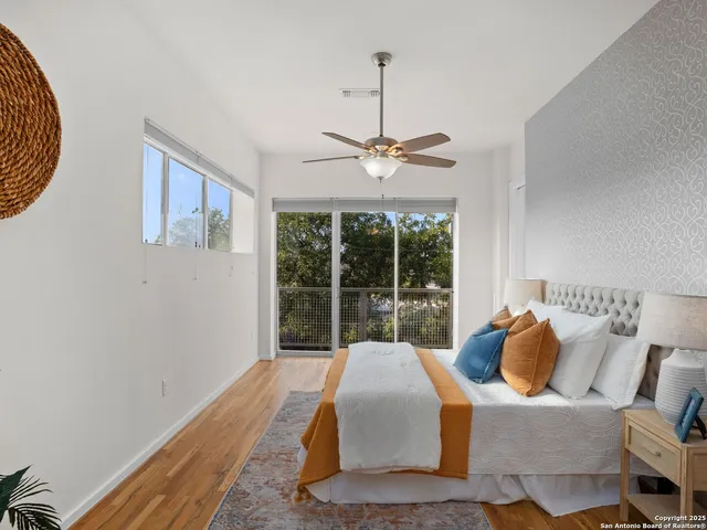 a bedroom with a bed and a lamp on table