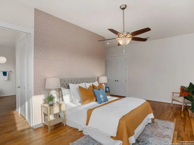a view of a living room with wooden floor