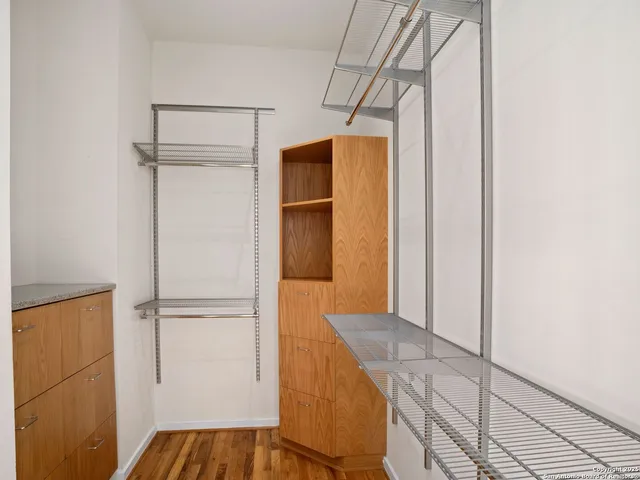 a living room with furniture and a book shelf