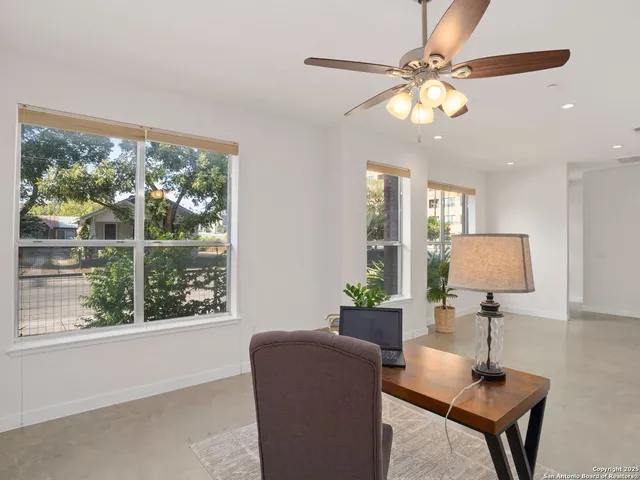 a room with furniture and a large window