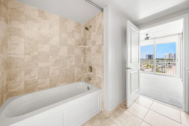 a bathroom with a bathtub and shower