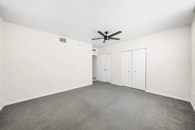 a view of a big room with carpet