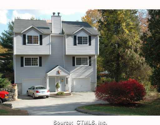 326 Boston Post Road, Unit 2 Waterford, CT 06385 - Photo 1 of 1 a view of a house with a garden and pathway