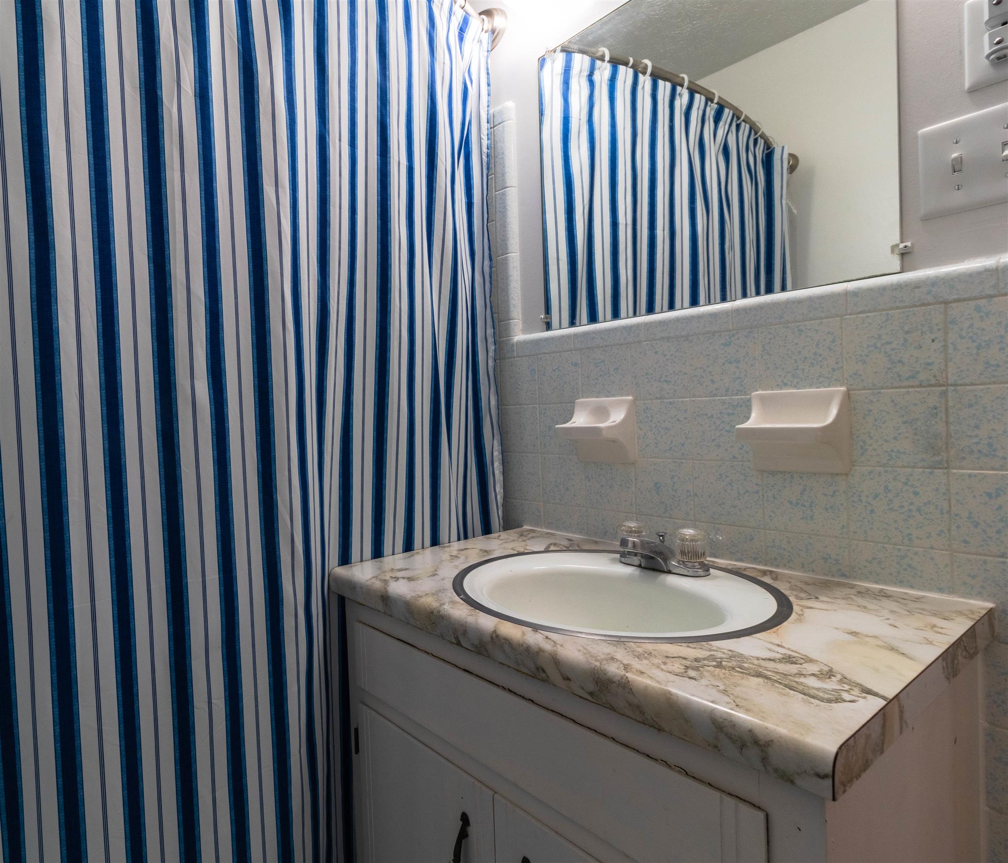 749 Durham Road Adams, TN 37010 - Photo 14 of 26 a bathroom with a sink and a mirror